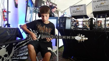 Fan playing a guitar at the Crazy Dave's Music Experience